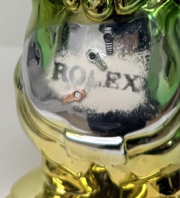 dagobert rolex details mini horloges in rolex stijl op beeld Dagobert Rolex
