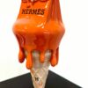 Melting Luxury Hermès Pop-art sculptuur van een smeltend Hermès Birkin ijsje oranje, 30 cm hoog.