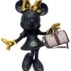 Mat zwart Minnie Mouse kunstbeeld van 30 cm hoog met gouden strik en handen, een Gucci-logo op de jurk en een schitterende miniatuur Gucci handtas.