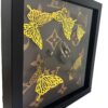 Butterfly LV 3d werk van 25 x 25 cm. met goudkleurige vlinders en mini tasje en mini mapje in Louis Vuitton Stijl getiteld Butterfly LV